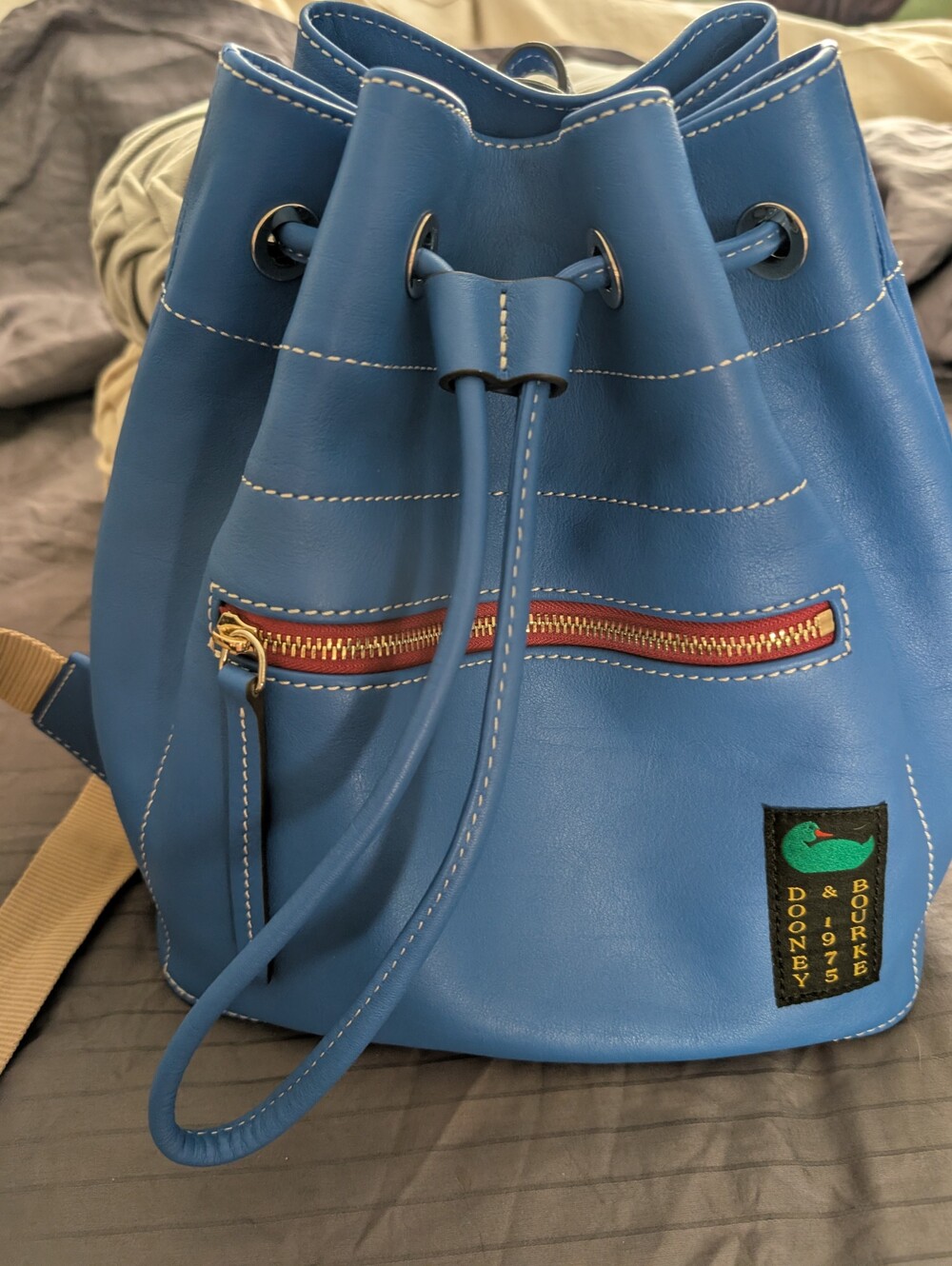 Dooney & Bourke Penrose Blue Leather Drawstring Bucket Backpack